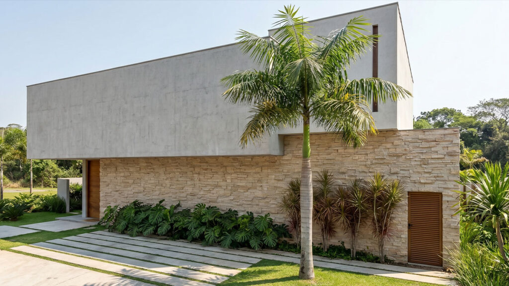Composição arquitetônica com contenção, textura e luz natural em residência de alto padrão, projeto de Raphael Davila.