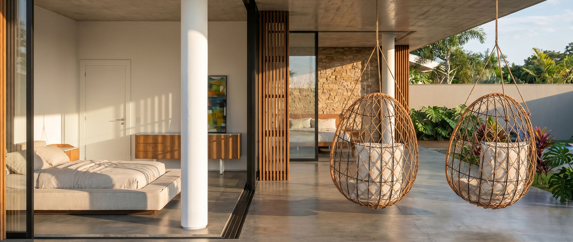 Suíte contemporânea integrada ao terraço com concreto aparente e cadeiras suspensas de palha — arquiteto de alto padrão com atendimento em São Paulo e todo o Brasil